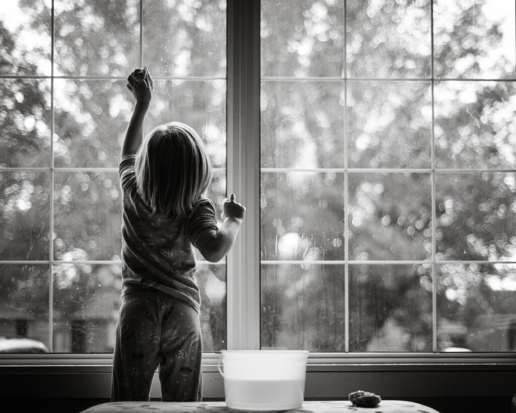 boy cleaning windows